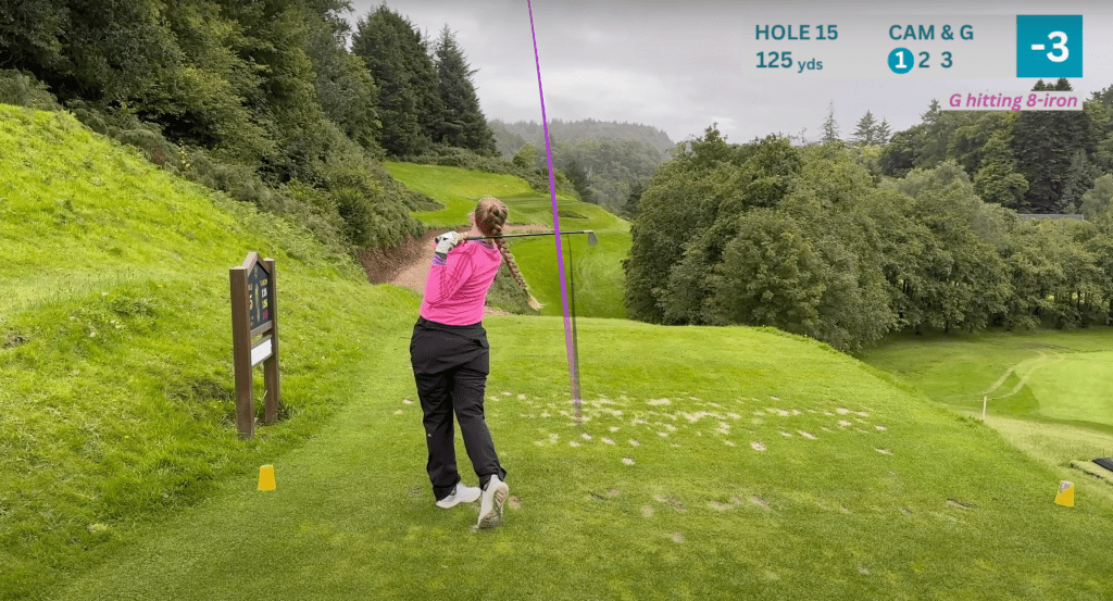 Georgina hitting her tee shot on the 15th hole, a picturesque par 3